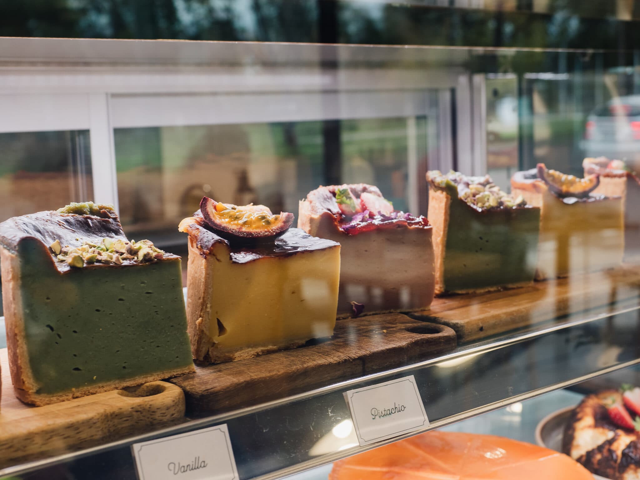 Assorted cake slices in the display case