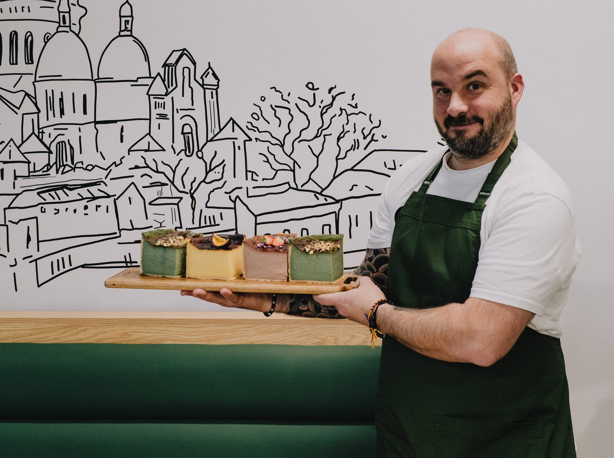 An Anaïs team member presenting dessert squares
