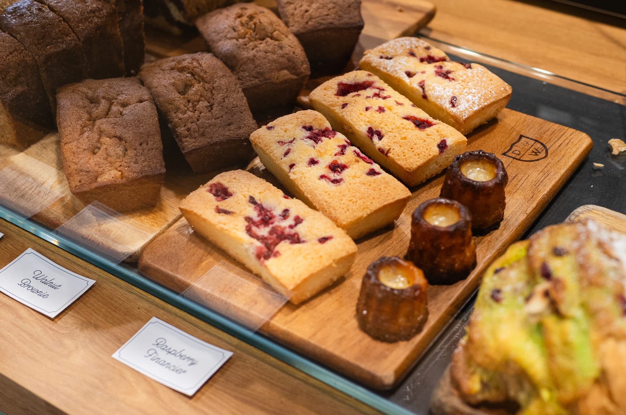 Loaf cakes, financiers and pastries in the display